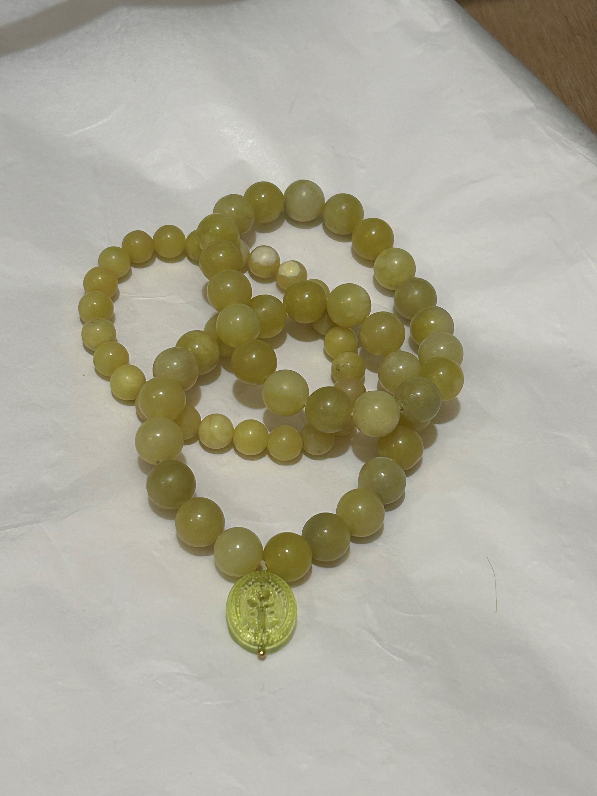 Golden jade trio with charm