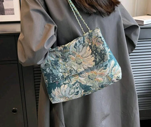 Tapestry clutch